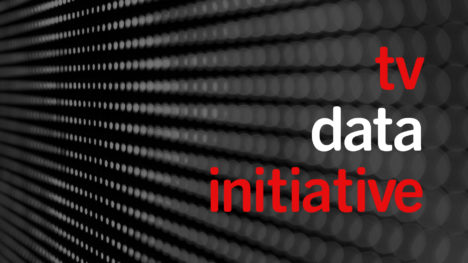 TV Date Initiative logo. 16:9 image with array of gray-on-black dots "zooming" away from the viewer in perspective. "tv / data / initiative" is in lowercase right-justified sans serif type on the right. "tv" and "initiative" are bright red; "data" is white.